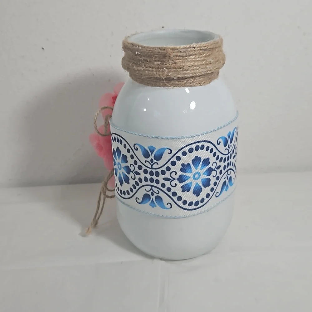 handmade white mason jar with floral blue ribbon and pink flower cross